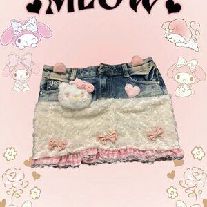 Cute pink and blue denim mini skirt with fuzzy lining, ruffles, and heart patche